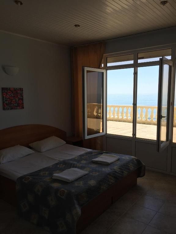 Двухместный (Улучшенный двухместный номер с 1 кроватью или 2 отдельными кроватями и видом на море) гостевого дома Вилла А-Лоо
