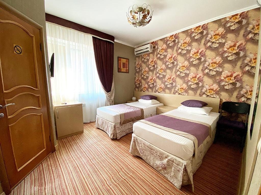 Двухместный (Стандартный двухместный номер с 2 отдельными кроватями) отеля Олимпия на Островского, Сочи