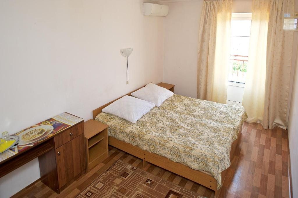 Двухместный (Двухместный номер с 2 отдельными кроватями и собственной ванной комнатой за пределами номера) гостевого дома Sea Breeze, Лоо