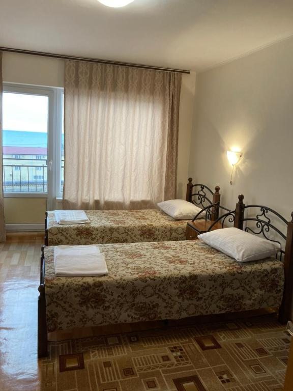 Двухместный (Двухместный номер с 2 отдельными кроватями и балконом) гостевого дома Sea Breeze, Лоо