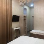 Четырехместный (Улучшенный четырехместный номер), Отель Grand Deluxe