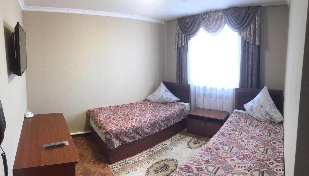 Двухместный (Двухместный номер с 2 отдельными кроватями и собственной ванной комнатой) отеля Логос Южно-Сахалинск