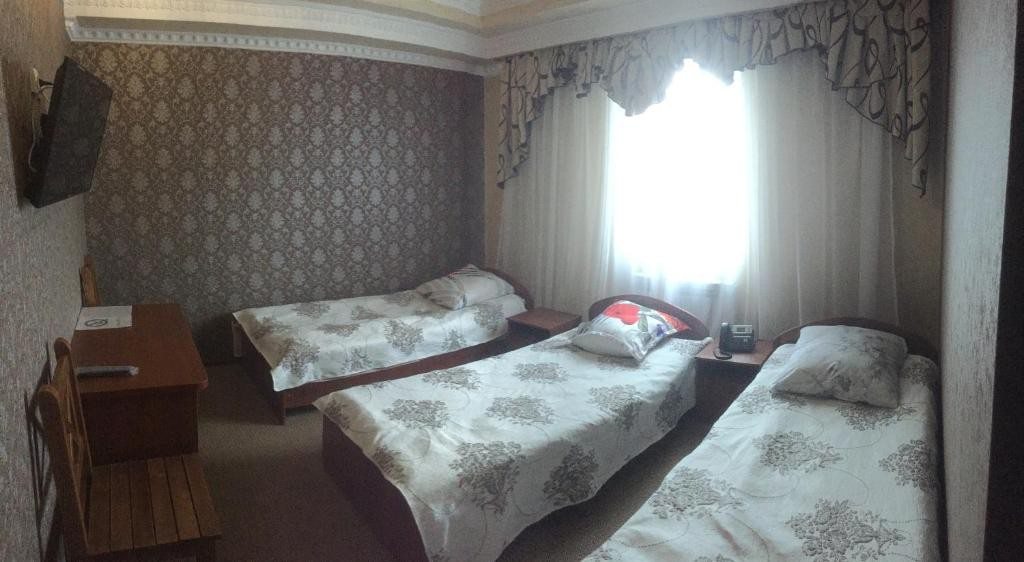 Номер (Односпальная кровать в общем номере для женщин) отеля Логос Южно-Сахалинск