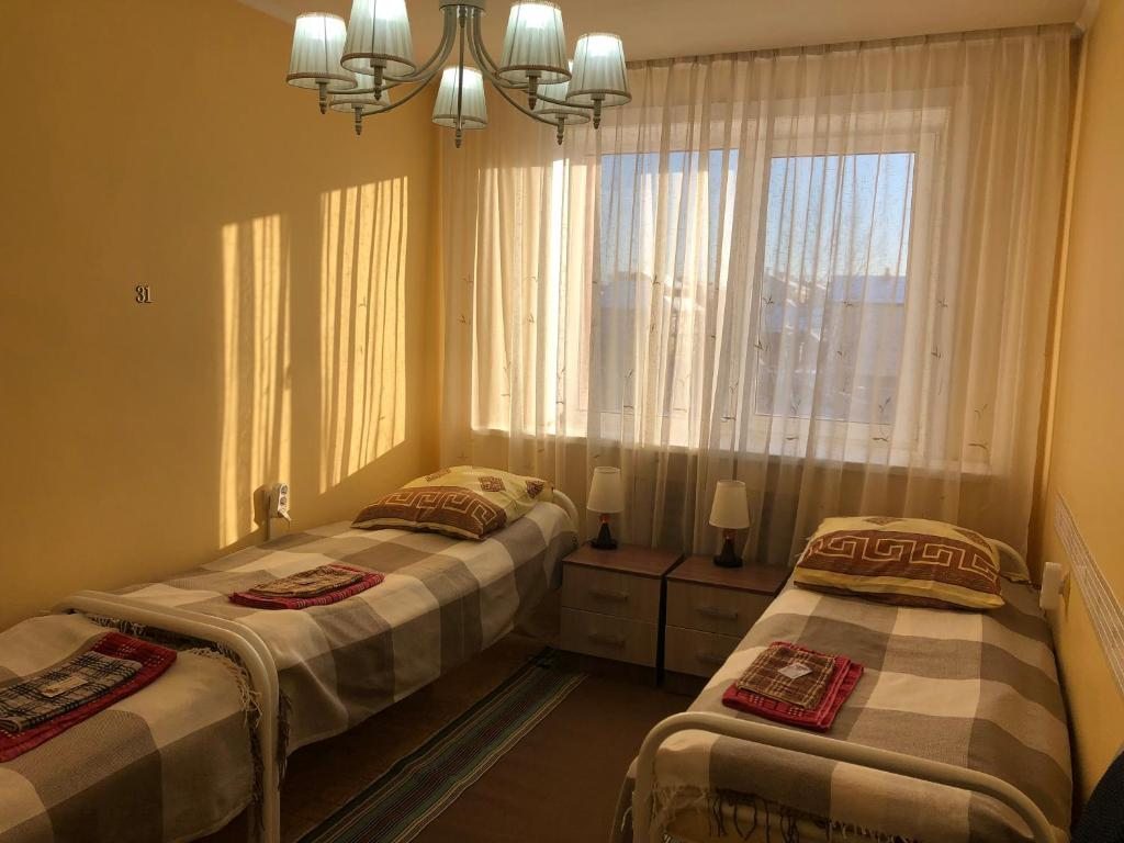 Номер (Односпальная кровать в общем мужском номере) гостевого дома Комфорт гостевой дом, Южно-Сахалинск