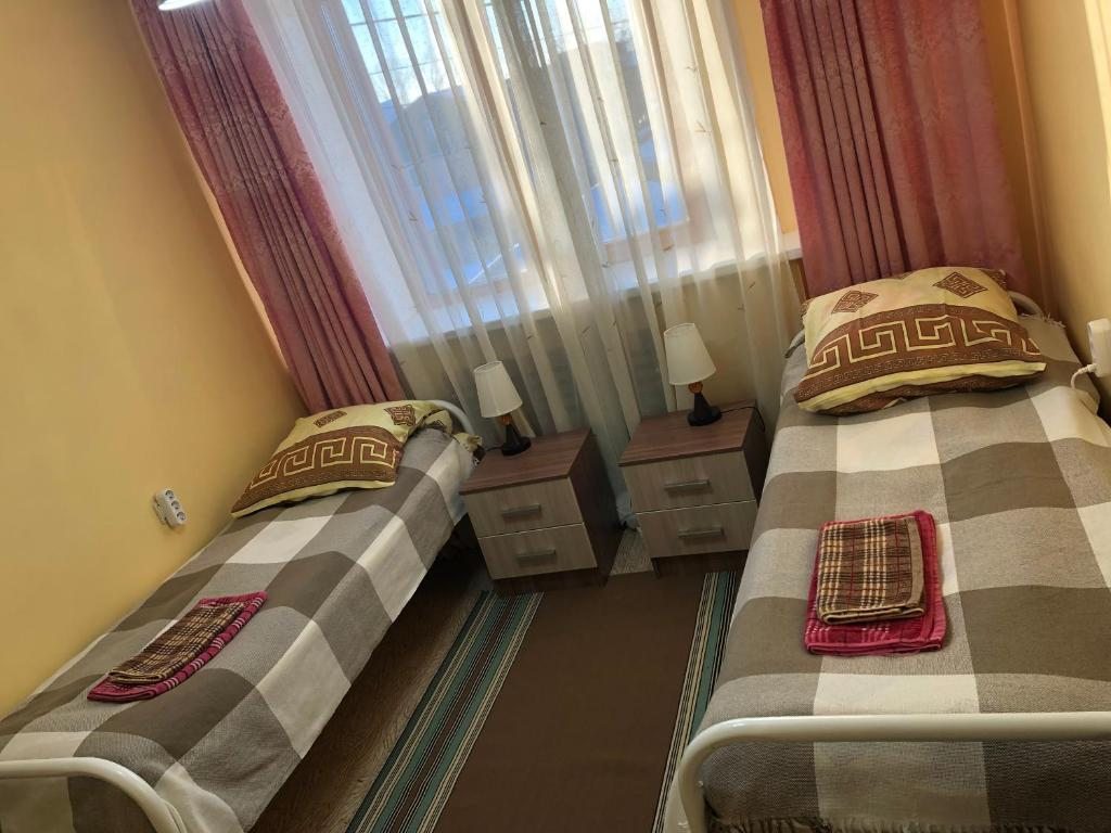 Номер (Односпальная кровать в общем номере) гостевого дома Комфорт гостевой дом, Южно-Сахалинск