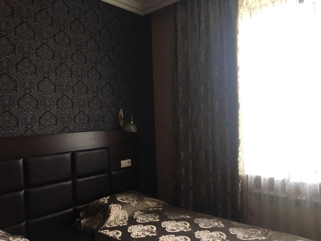 Двухместный (Большой двухместный номер с 2 отдельными кроватями) отеля Hotel Central, Видное