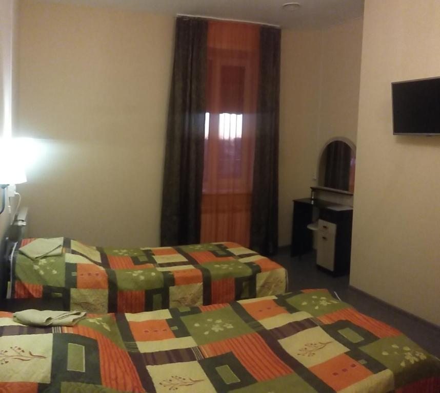 Двухместный (Большой двухместный номер с 2 отдельными кроватями) отеля Мини-Отель Лира, Ковров
