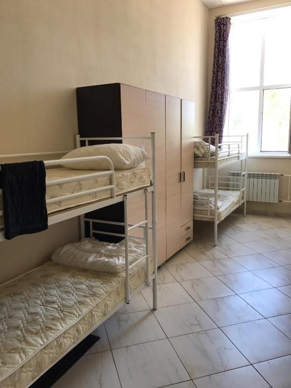Номер (Односпальная кровать в общем номере с 4 кроватями) отеля Гостиный двор, Новокуйбышевск