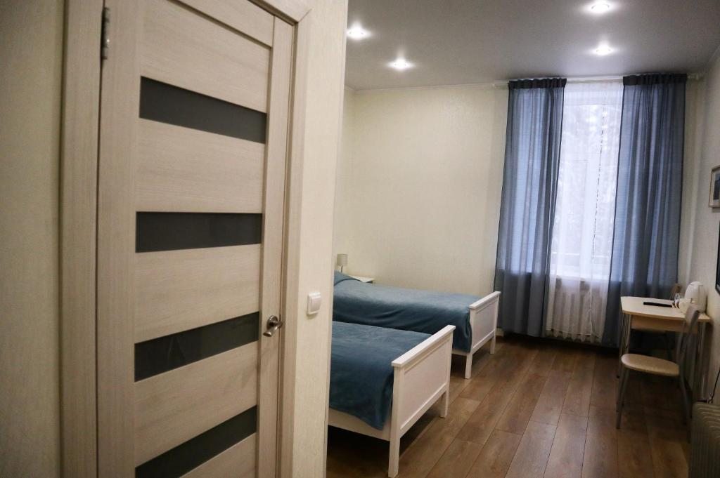 Двухместный (Двухместный номер с 2 отдельными кроватями и собственной ванной комнатой) отеля Хвойный парк, Лахденпохья