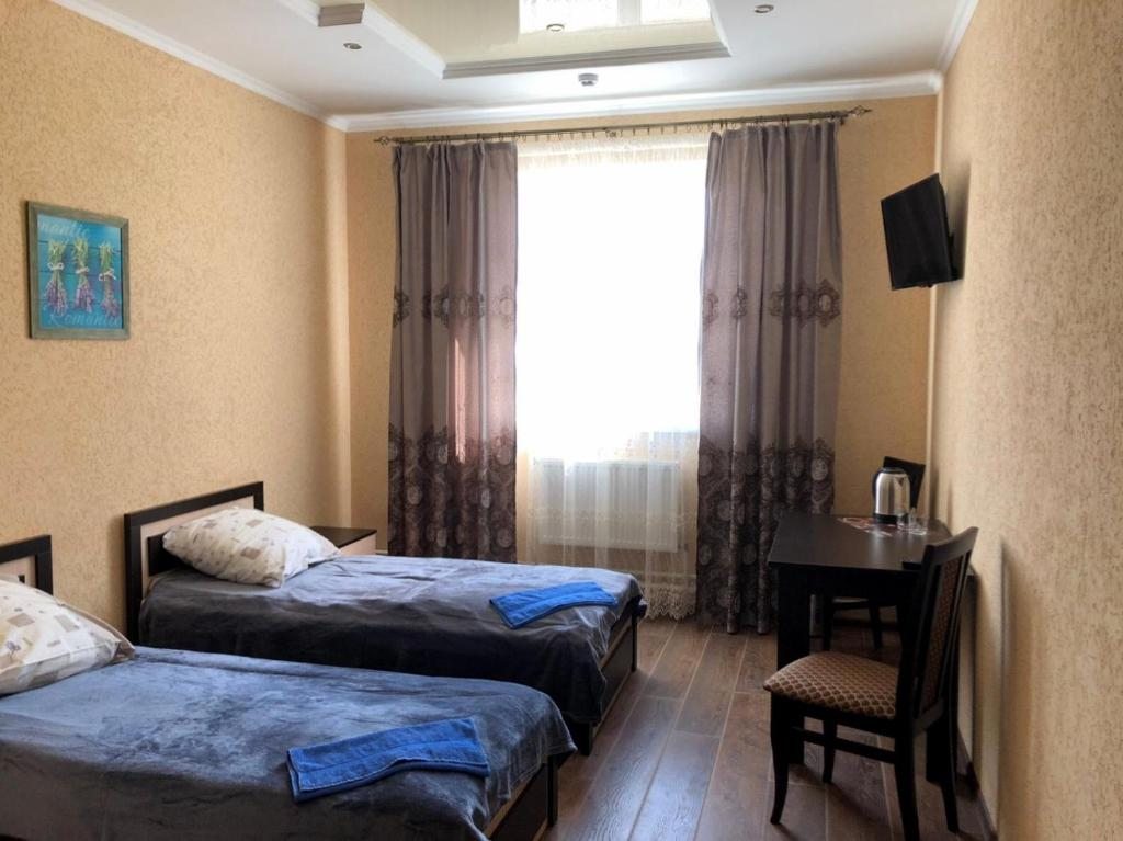 Двухместный (Бюджетный двухместный номер с 2 отдельными кроватями) мотеля Уют Отель, Барановичи