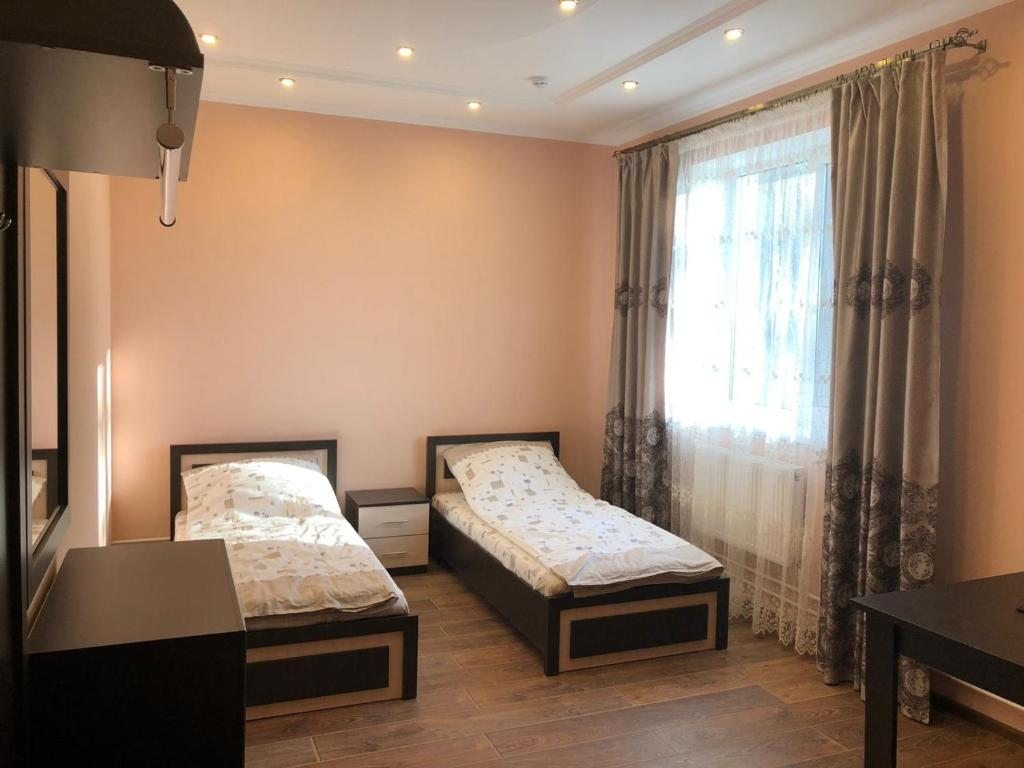 Двухместный (Двухместный номер Делюкс с 2 отдельными кроватями) мотеля Уют Отель, Барановичи