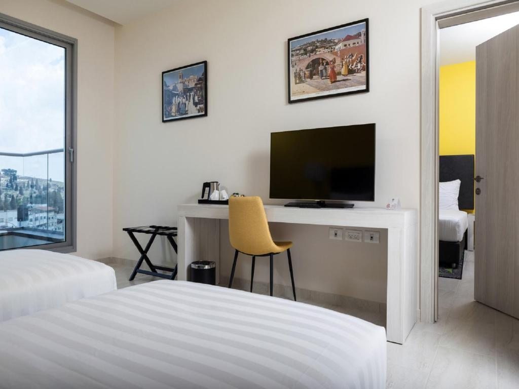 Двухместный (Двухместный номер Делюкс с 1 кроватью или 2 отдельными кроватями) отеля Legacy Hotel ַ& Convention Center Nazareth, Назарет