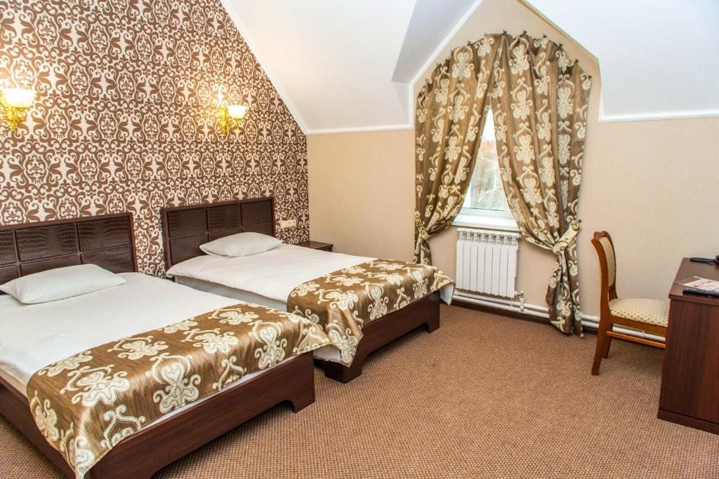 Двухместный (Стандартный двухместный номер с 2 отдельными кроватями) гостиницы KaroZA, Петровское