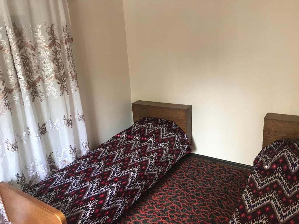 Двухместный (Бюджетный двухместный номер с 2 отдельными кроватями) хостела Diyor Hostel, Бухара