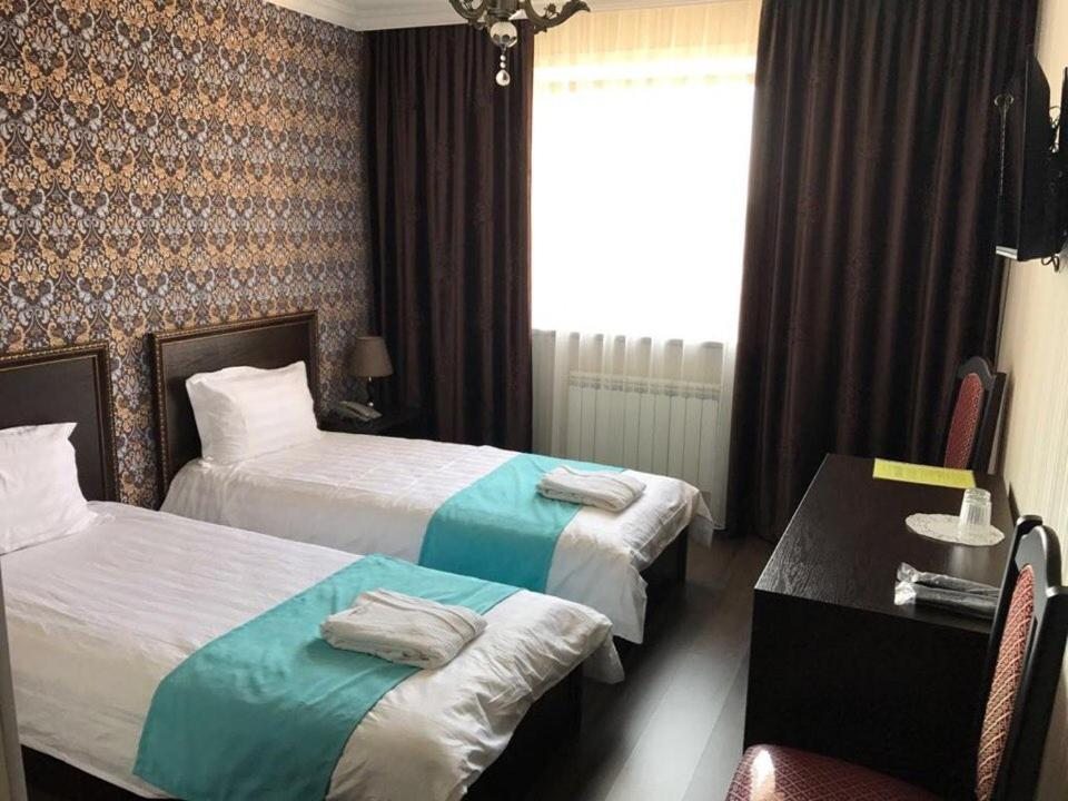 Двухместный (Бюджетный двухместный номер с 2 отдельными кроватями) отеля Букпа, Караганда