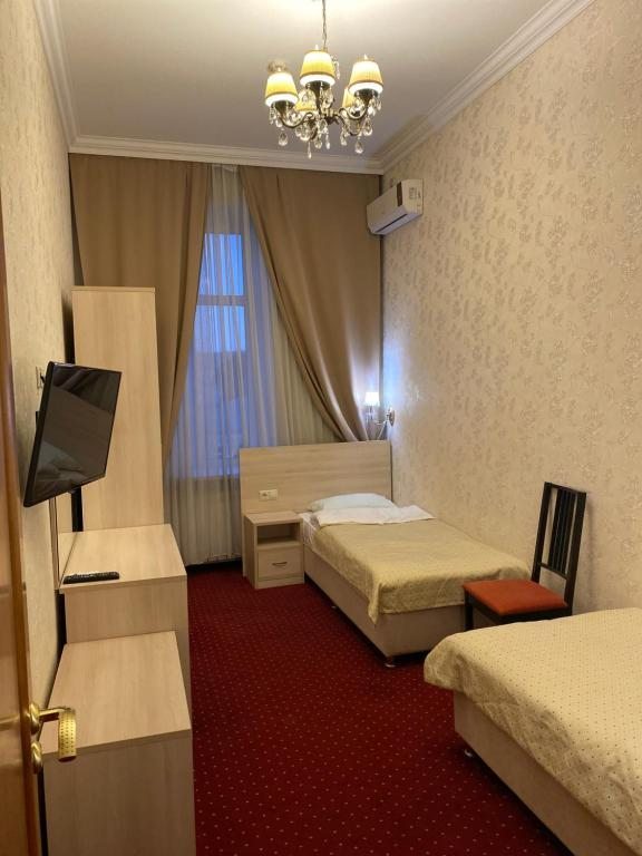 Двухместный (Стандартный двухместный номер с 2 отдельными кроватями) мини-отеля Basmanny Inn, Москва