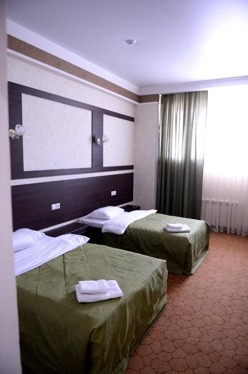 Двухместный (Двухместный номер Делюкс с 2 отдельными кроватями) отеля Pride, Тараз