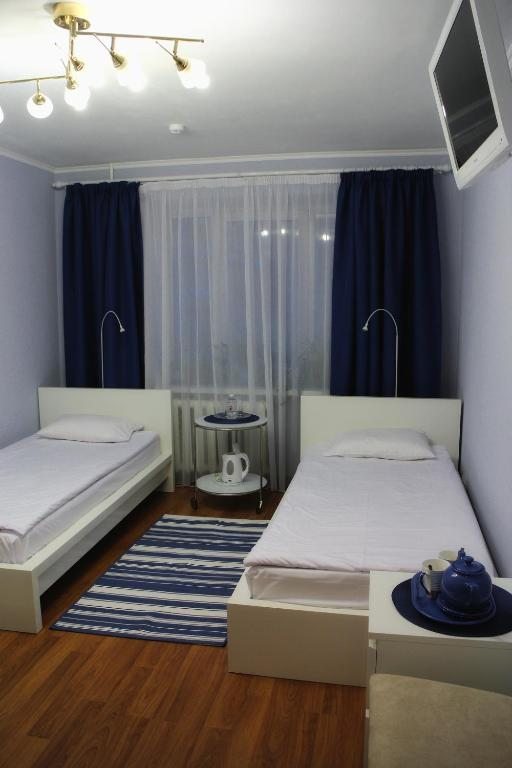Двухместный (Двухместный номер комфорт с 2 отдельными кроватями и собственной ванной комнатой) мини-отеля Хозяюшка, Пермь