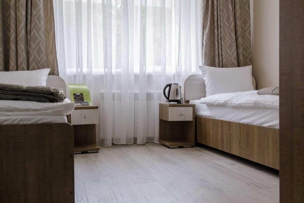 Номер (Односпальная кровать в общем номере) гостиницы CARE, Красноярск