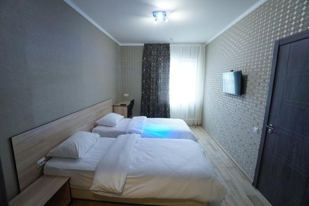 Двухместный (Бюджетный двухместный номер с 2 отдельными кроватями) отеля City M, Саратов