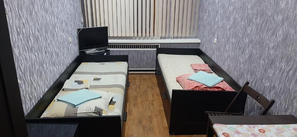 Двухместный (Двухместный номер с 2 отдельными кроватями и общей ванной комнатой) мини-отеля ССК, Воронеж