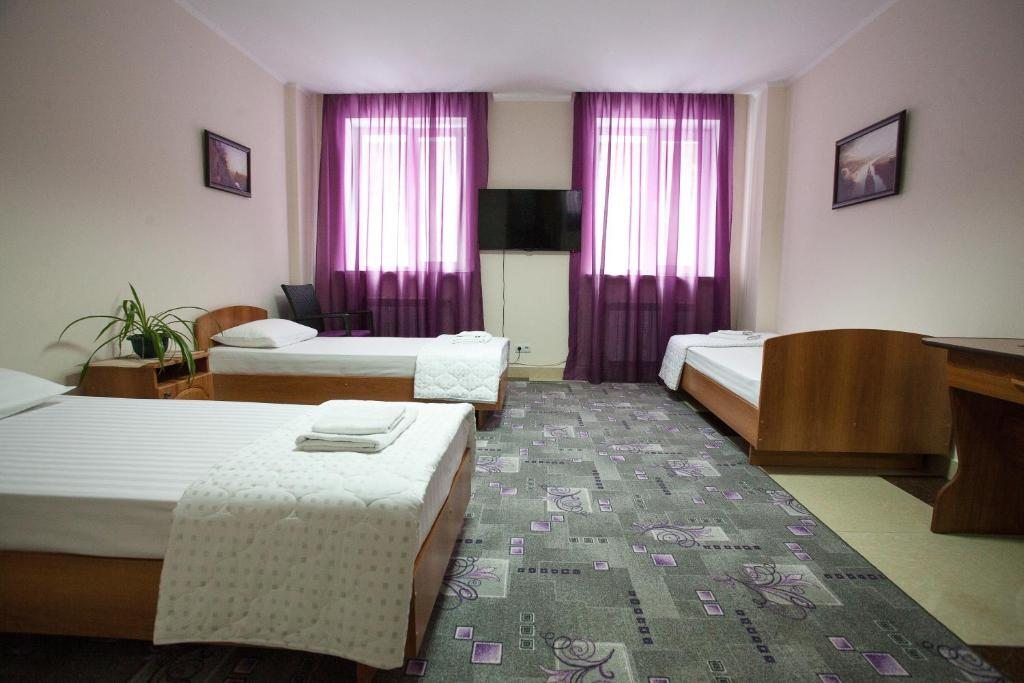 Номер (Кровать в общем номере для мужчин) мини-гостиницы Шамбала, Белгород