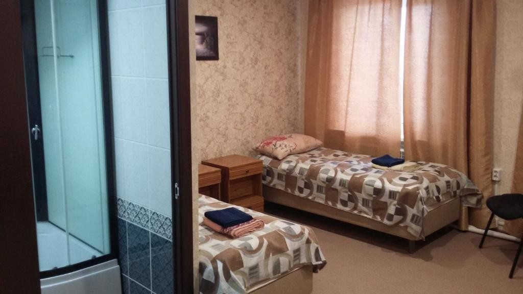 Двухместный (Двухместный номер с 2 отдельными кроватями) отеля Приуралье, Лабытнанги