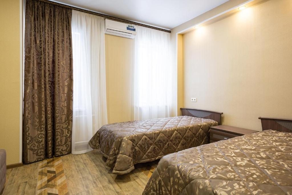 Двухместный (Двухместный номер с 2 отдельными кроватями) гостиницы АКВА РУМ, Кемерово