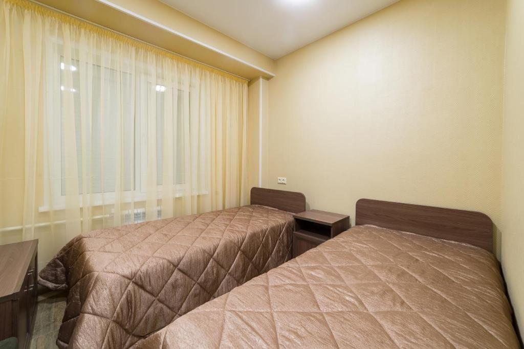 Двухместный (Двухместный номер эконом-класса с 2 отдельными кроватями) гостиницы АКВА РУМ, Кемерово