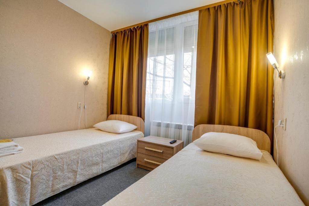 Двухместный (Двухместный номер с 2 отдельными кроватями и общей ванной комнатой) отеля Ладомир на Щёлковской, Москва