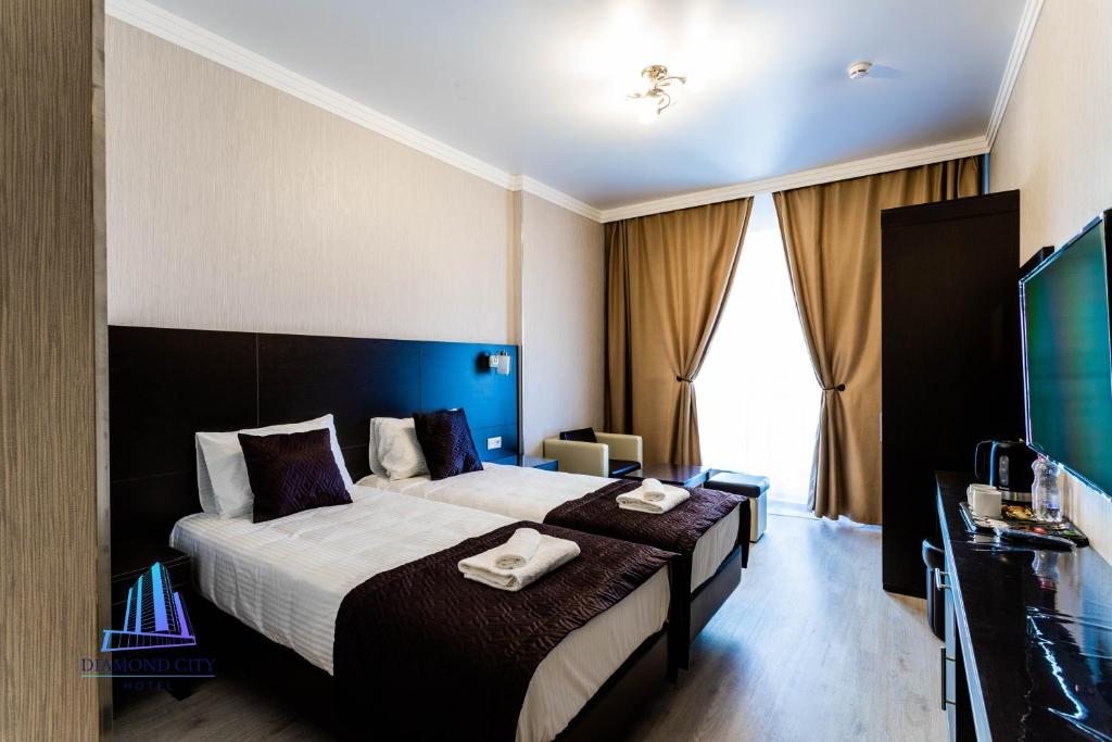 Двухместный (Двухместный номер Делюкс с 1 кроватью или 2 отдельными кроватями) отеля Diamond City, Санкт-Петербург