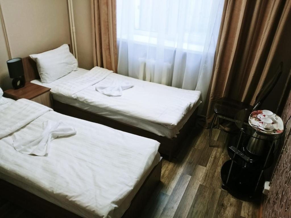 Двухместный (Двухместный номер с 1 кроватью или 2 отдельными кроватями и собственной ванной комнатой) отеля Альбатрос, Хабаровск