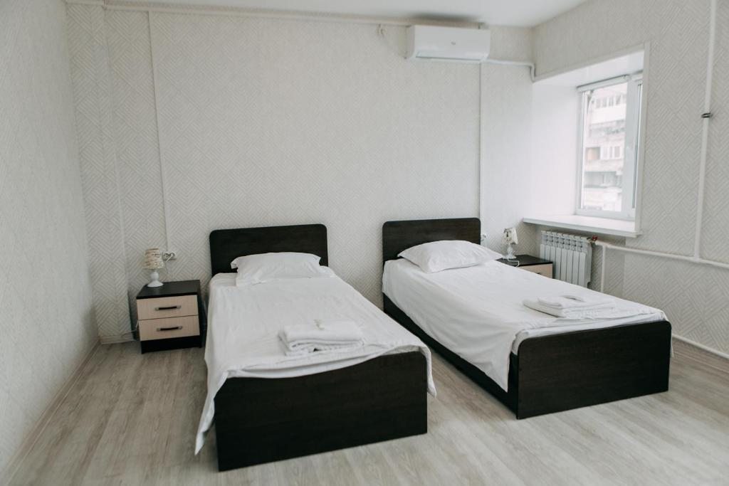 Двухместный (Двухместный номер с 2 отдельными кроватями и общей ванной комнатой) гостиницы Золотая Ригма, Хабаровск