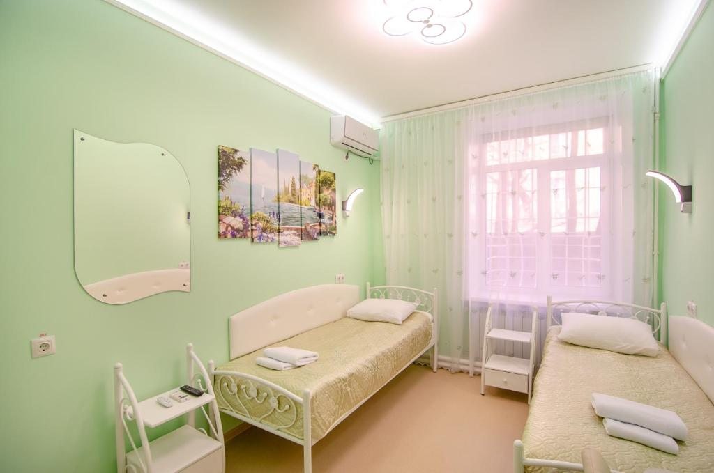 Двухместный (Двухместный номер с 2 отдельными кроватями и общей ванной комнатой) мини-отеля МилСон, Хабаровск