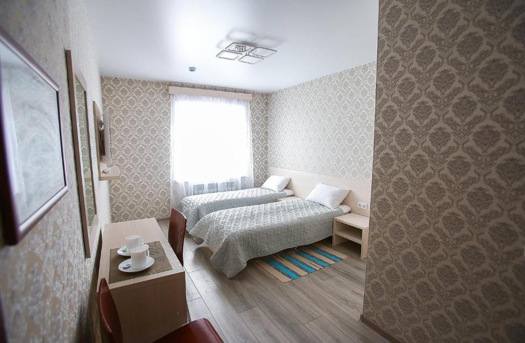Двухместный (Улучшенный двухместный номер с 2 отдельными кроватями) отеля Старый Город, Барнаул