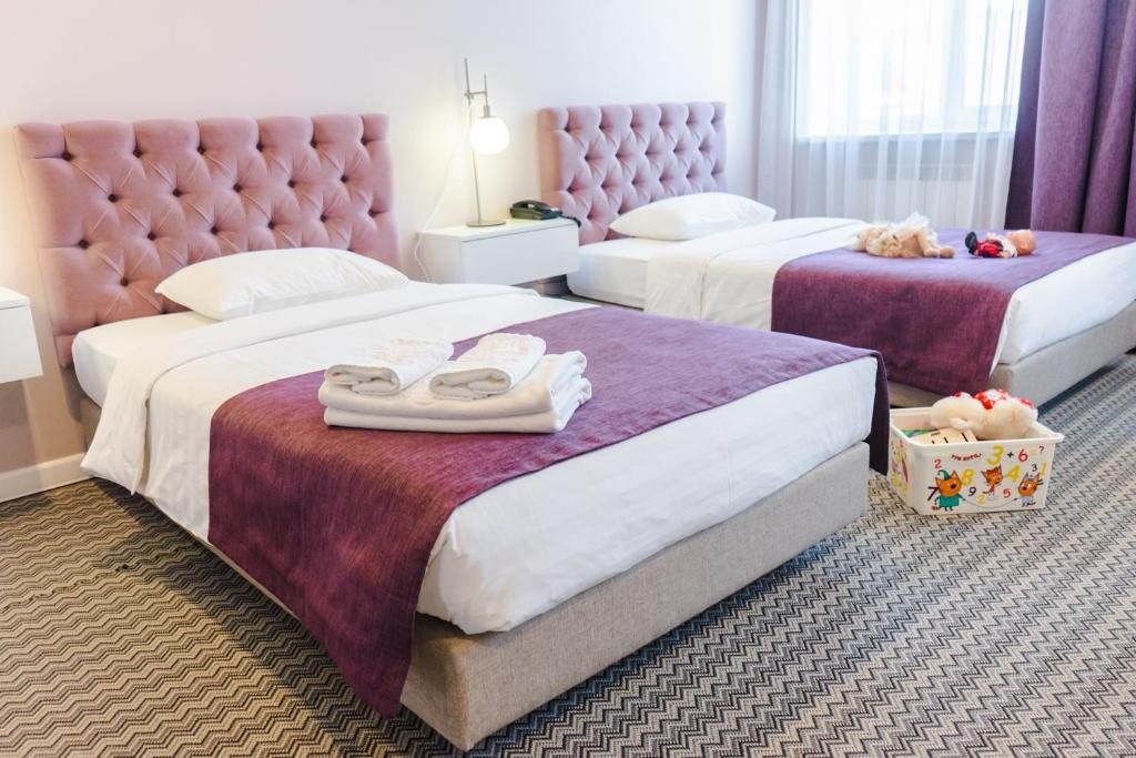 Двухместный (Двухместный номер Делюкс с 2 отдельными кроватями) отеля Marco Polo, Уссурийск