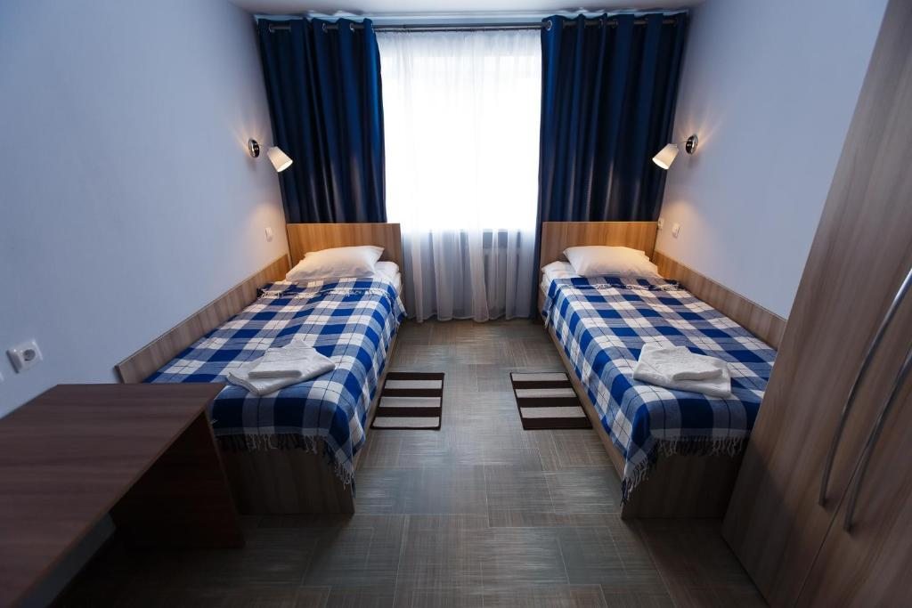 Номер (Кровать в общем номере с 2 кроватями) отеля Полёт, Сыктывкар