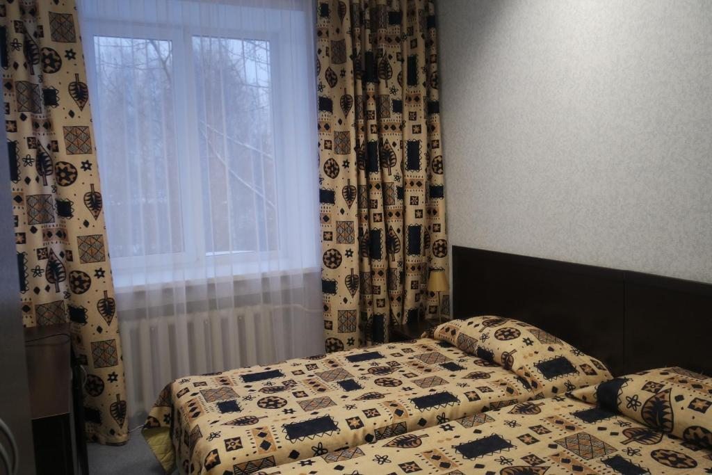 Двухместный (Стандартный двухместный номер с 2 отдельными кроватями и общей ванной комнатой) отеля Hotel Kamskiy Cable, Пермь