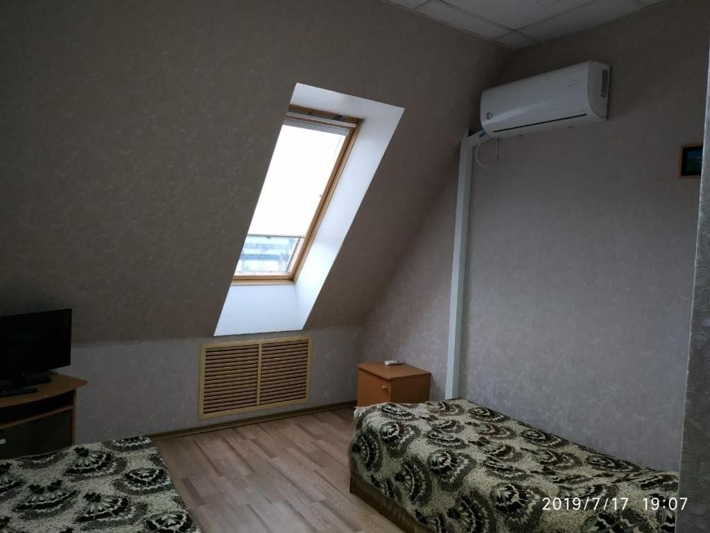 Двухместный (Двухместный номер с 2 отдельными кроватями и собственной ванной комнатой) отеля Олимп, Спасск