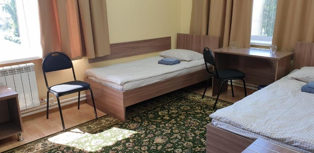 Номер (Односпальная кровать в общем мужском номере) хостела Игман, Горно-Алтайск
