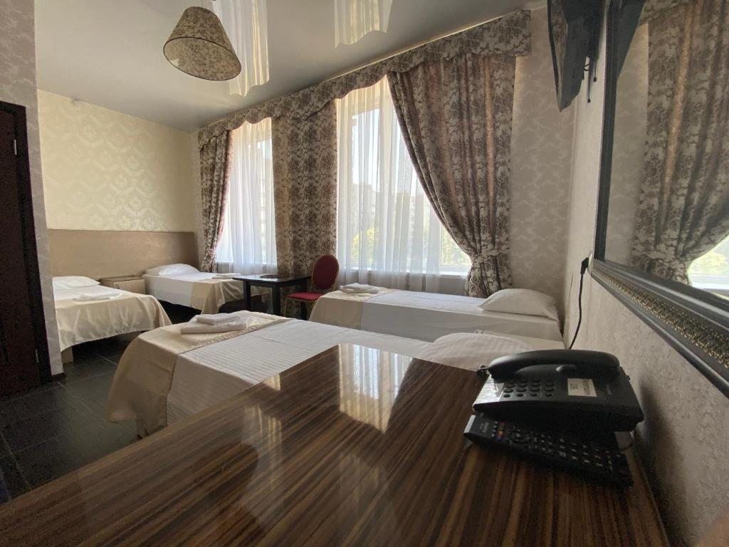 Четырехместный (Стандартный четырехместный номер) отеля Петров Двор, Волгоград