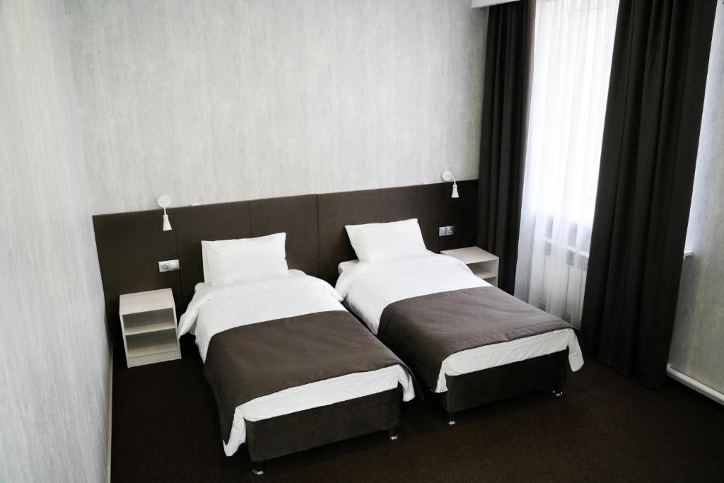Двухместный (Улучшенный двухместный номер с 2 отдельными кроватями) отеля Вояж, Нижнекамск
