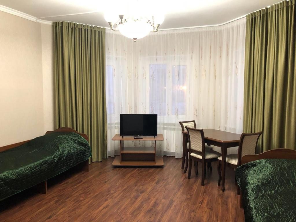 Номер (Односпальная кровать в общем мужском номере) отеля Мини-отель на Чапаева 3, Нижневартовск