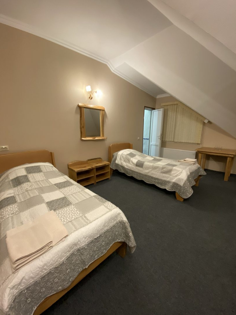Двухместный (Стандартный двухместный номер с двумя раздельными кроватями) мини-отеля Pamir, Терскол