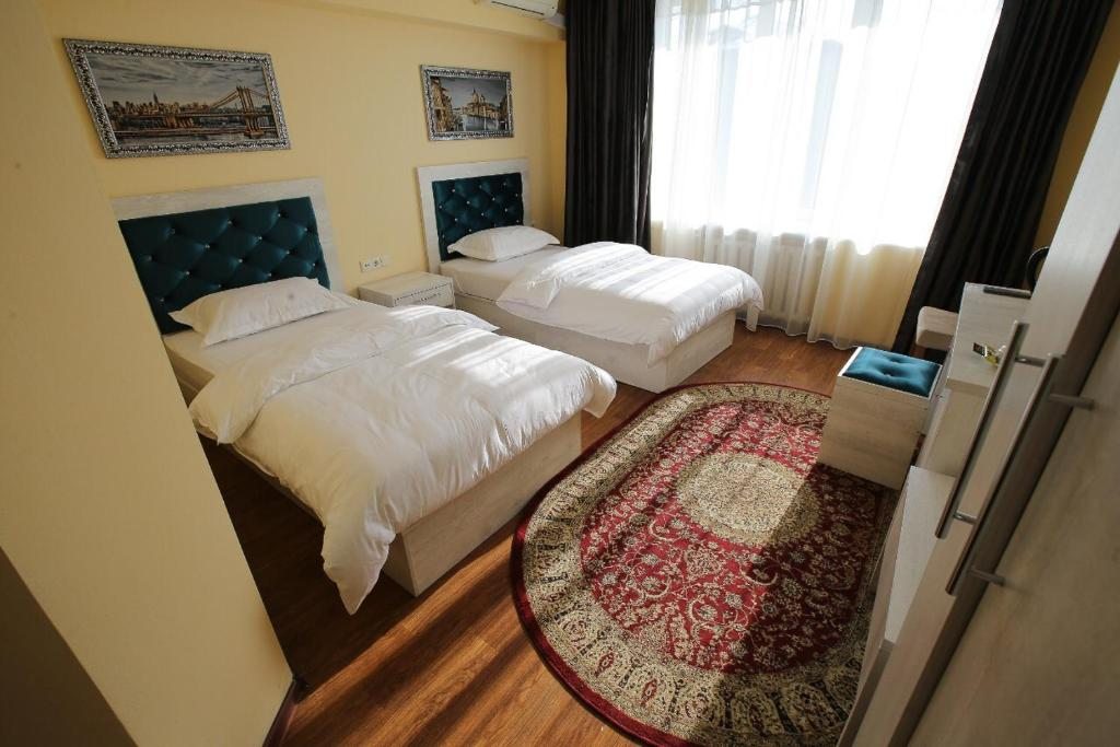 Двухместный (Улучшенный двухместный номер с 2 отдельными кроватями) отеля Altai Business Hotel, Алматы
