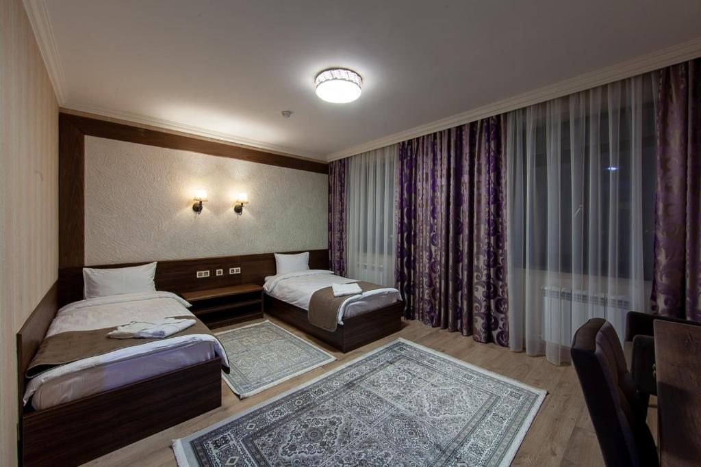 Двухместный (Двухместный номер с 2 отдельными кроватями и душем) отеля Sacvoyage Hotel, Алматы