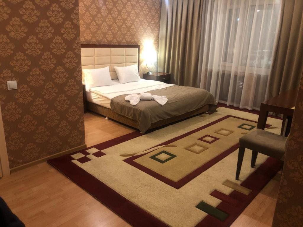 Двухместный (Двухместный номер Делюкс с 1 кроватью или 2 отдельными кроватями) отеля Hotel Inju, Астана
