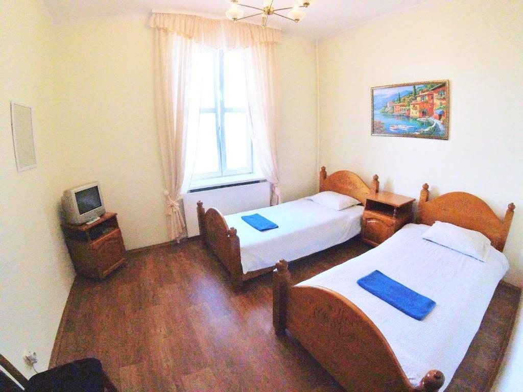 Двухместный (Двухместный номер с 2 отдельными кроватями и общей ванной комнатой) отеля ГранПри, Минск