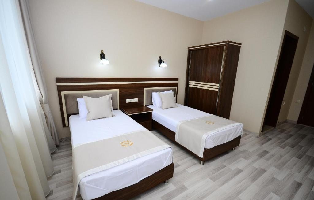 Двухместный (Просторный двухместный номер с 2 отдельными кроватями) отеля Hotel 725 B, Батуми