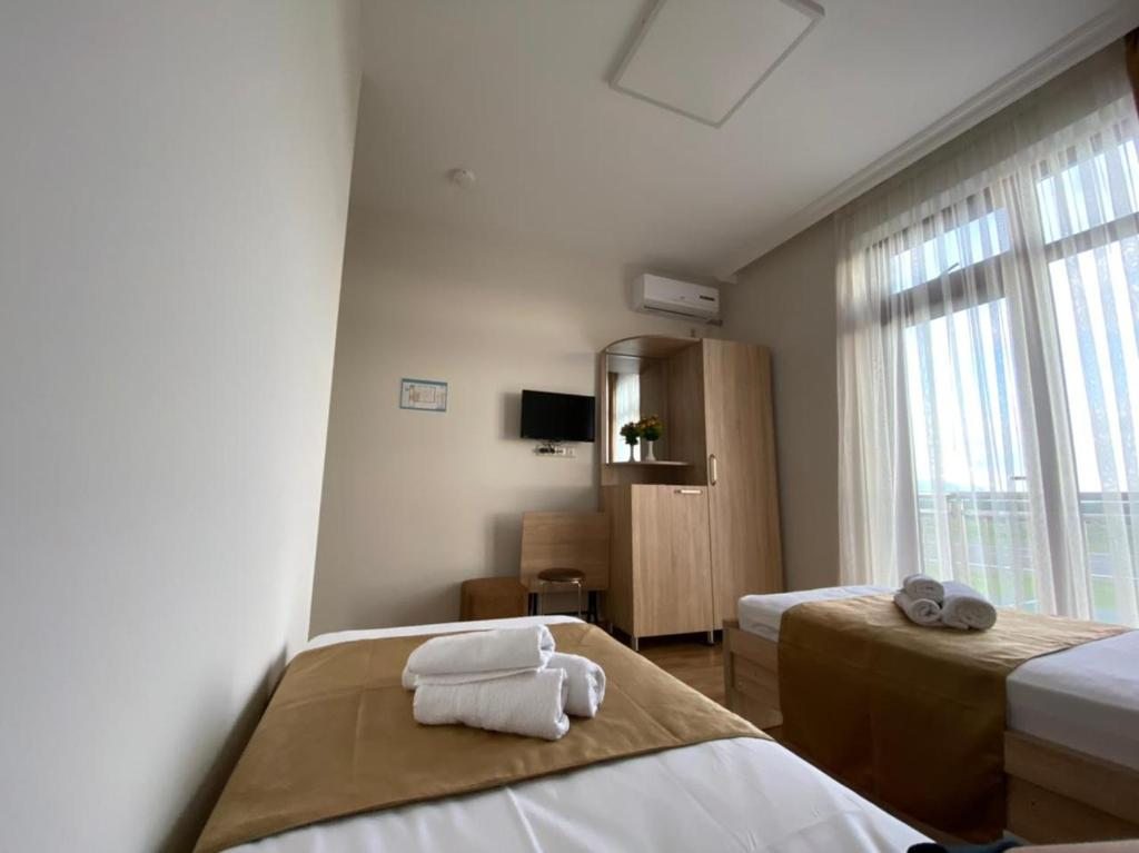 Двухместный (Стандартный двухместный номер с 2 отдельными кроватями) отеля Orange Garden Hotel, Батуми